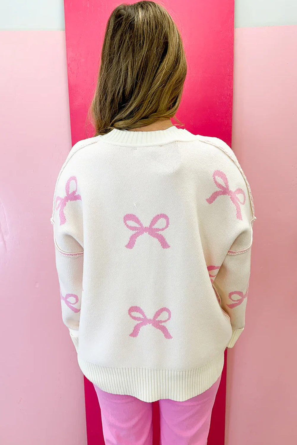Pink Bow Print Ribbed Trim Exposed Seam Drop Shoulder Loose Sweater